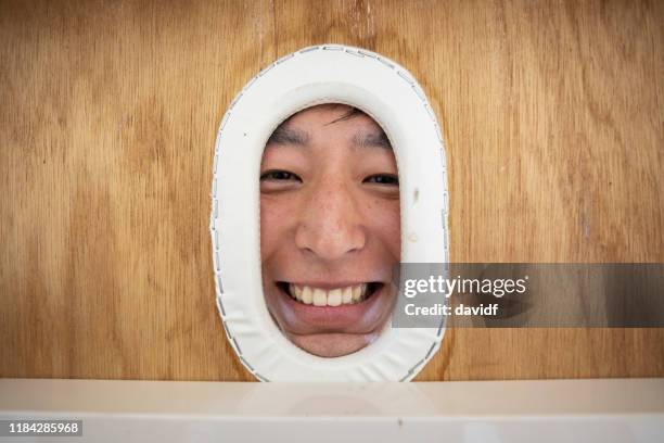 face of an asian man getting a massage - massage table stock pictures, royalty-free photos & images