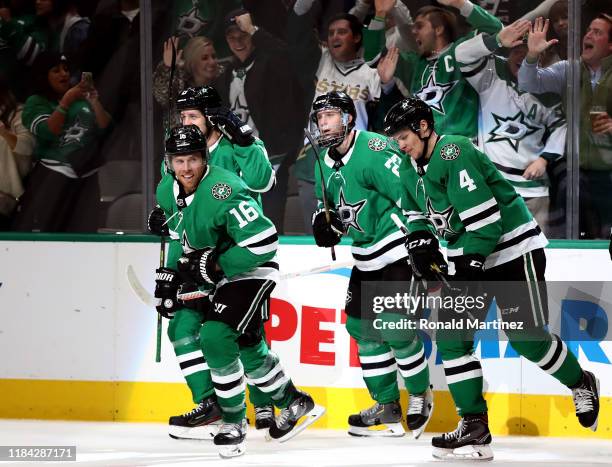 The Dallas Stars celebrate a goal by Joe Pavelski of the Dallas Stars against the Minnesota Wild in the third period at American Airlines Center on...