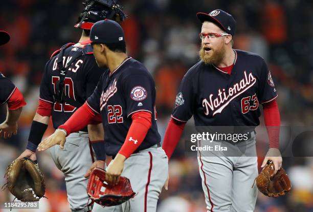 Sean Doolittle and Juan Soto of the Washington Nationals celebrate their teams 7-2 win against the Houston Astros in Game Six of the 2019 World...