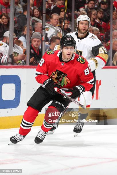 Patrick Kane of the Chicago Blackhawks skates ahead of Jake Bischoff of the Vegas Golden Knights in the second period at the United Center on October...