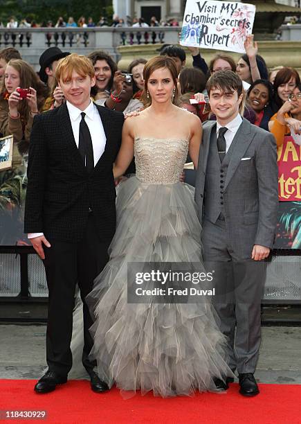 Rupert Grint, Emma Watson and Daniel Radcliffe attend the world premiere of 'Harry Potter And The Deathly Hallows Part 2' at Trafalgar Square on July...