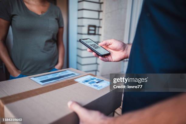 mature man delivery a package to a customer - gig economy stock pictures, royalty-free photos & images