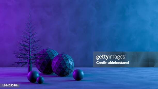 3d kerstboom en ornamenten met neon lichten op zwarte achtergrond - blue winter tree stockfoto's en -beelden