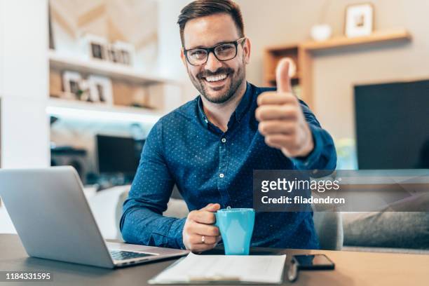 home office - thumbs up stock pictures, royalty-free photos & images