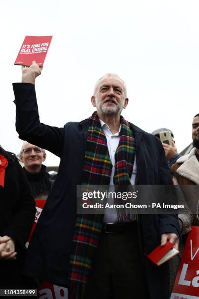 Labour Party leader Jeremy Corbyn, holds up his party's manifesto as he speaks to supporters during a visit to Thurrock in Essex whilst on the...