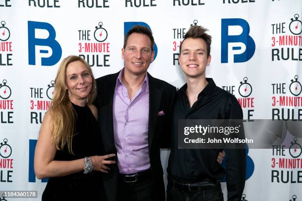 Juliana and Brant Pindivic with their son Braden attend the red carpet event featuring business influencers, celebrities and leading network...