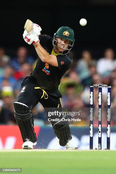 David Warner of Australia bats during game two of the Men's International Twenty20 series between Australia and Sri Lanka at The Gabba on October 30,...