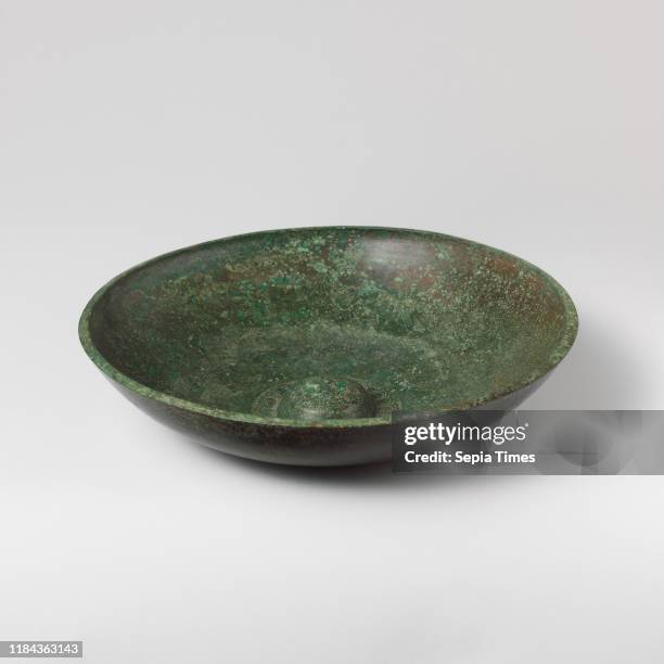 Bronze phiale , Late Classical, 4th century B.C., Greek, Bronze, 1 3/8 _ 6 1/4 in. , Bronzes, The flatter bowl and the ornament around the omphalos...