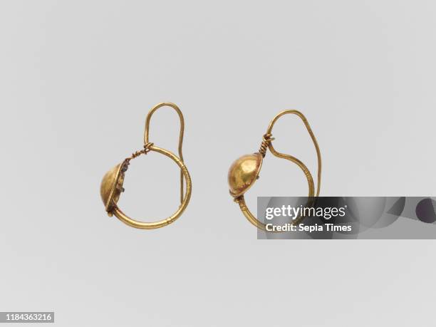 Gold earring with convex disc, Imperial, 2nd century A.D., Roman, Gold, Other: 1 1/8 in. , Gold and Silver, Delta-shaped earrings have the free end...