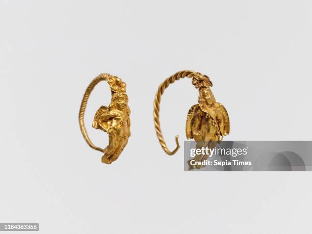 Gold earring with winged figure, Hellenistic, 3rd?2nd century B.C., Greek, Gold, Diam.: 13/16 in. , Gold and Silver, Circlet of twisted gold wire,...