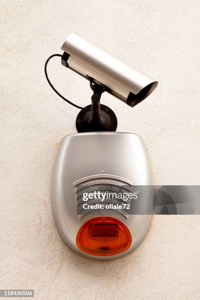 telecamera on a grey wall - alarm system stock pictures, royalty-free photos & images