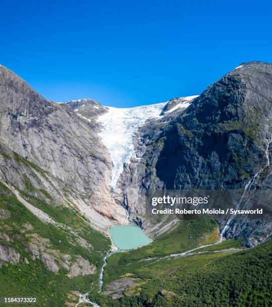 briksdalsbreen glacier and lake, loen, norway - jostedalsbreen stock pictures, royalty-free photos & images