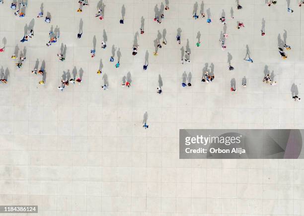 man standing out of a crowd - crowd of people from above stock pictures, royalty-free photos & images