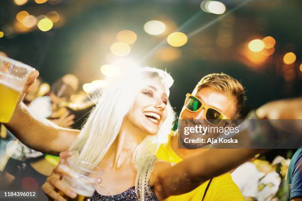 festival vibe. - couple concert stock pictures, royalty-free photos & images