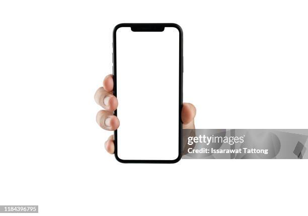 close up hand hold phone isolated on white, mock-up smartphone white color blank screen - demonstration fotografías e imágenes de stock