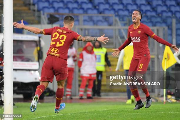 Roma's Italian defender Gianluca Mancini celebrates with AS Roma's English defender Chris Smalling after scoring his team's second goal during the...