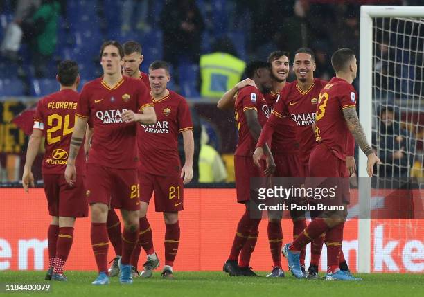 Chris Smalling with his teammates of AS Roma celebrates after scoring the opening goal during the Serie A match between AS Roma and Brescia Calcio at...