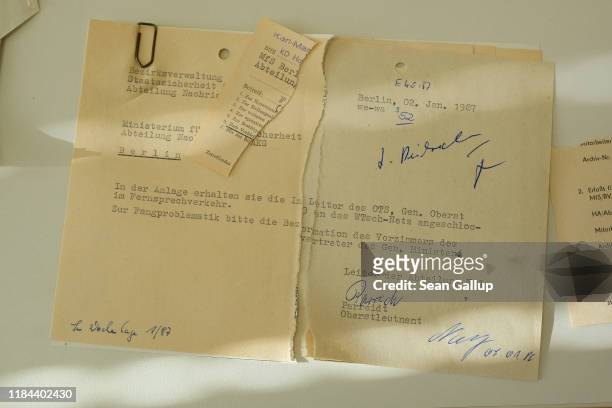 Torn documents of the former East German secret police, the Stasi, lie on a table at the archive of the Federal Commissioner for the Records of the...