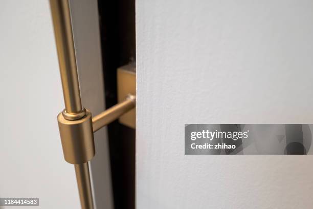 metal rod fixing bracket on white wall background - doorknob stock pictures, royalty-free photos & images