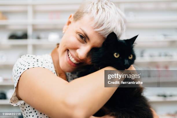 bring pet to work day - black cat stock pictures, royalty-free photos & images