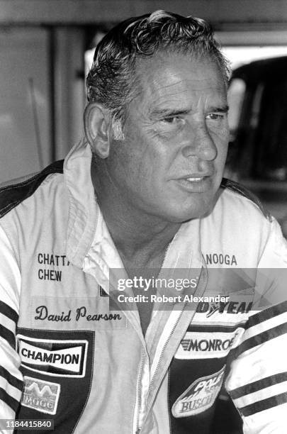 Driver David Pearson sits in the speedway garage prior to the start of the 1985 Daytona 500 stock car race at Daytona International Speedway in...