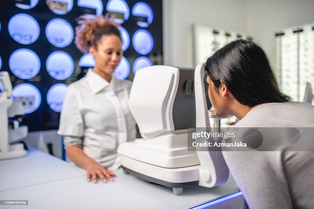 Indian woman getting an eye exam at the doctor's office