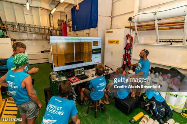 Expedition members working for project Amazon Reef use a sonar to scan the bottom of the ocean on September 13, 2019 off the French Guyana.