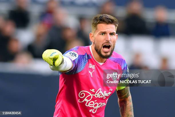 Bordeaux's French goalkeeper Benoit Costil gestures during the French L1 football match between FC Girondins de Bordeaux and AS Monaco at the Matmut...