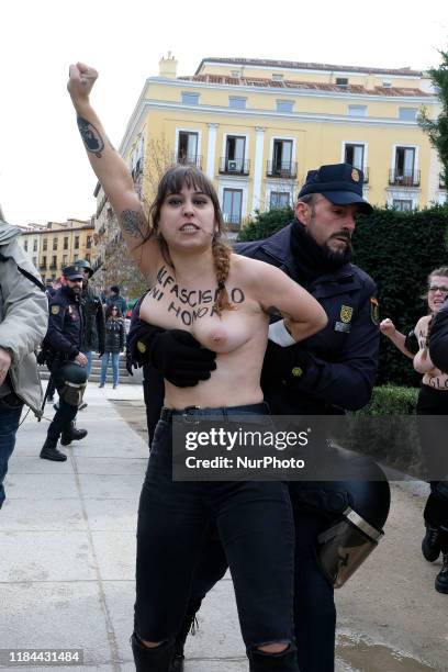 This image contains nudity.) FEMEN activist with body paint reading 'To fascism neither honor nor glory' during a rally commemorating the 44th...