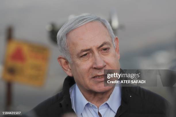 Israel's Prime Minister Benjamin Netanyahu is seen during a visit to an army base in the Israeli-annexed Golan Heights overlooking Syrian territory,...