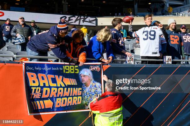 Chicago Bears fans put up a sign prior to an NFL football game between the New York Giants and the Chicago Bears on November 24 at Soldier Field in...