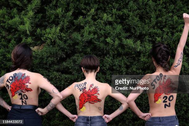 Members of the feminist movement Femen protest against a far right demonstration marking the anniversary of the death of Spanish late dictator...
