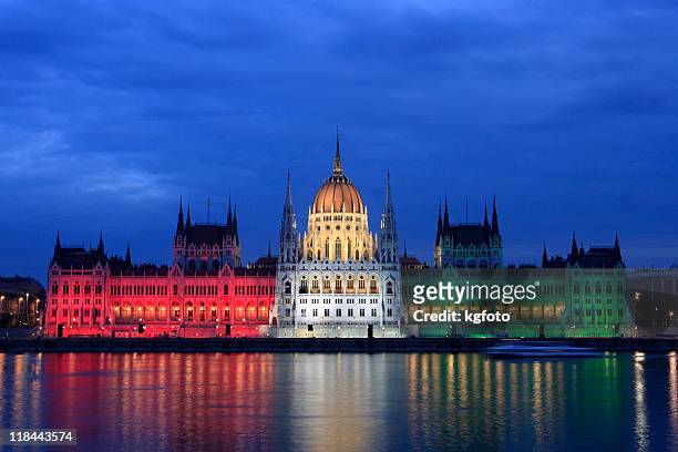 parliament at dusk in budapest, hungary - budapest parliament stock pictures, royalty-free photos & images