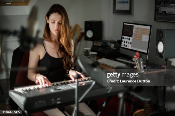 music production keyboard woman - electronic music stock pictures, royalty-free photos & images