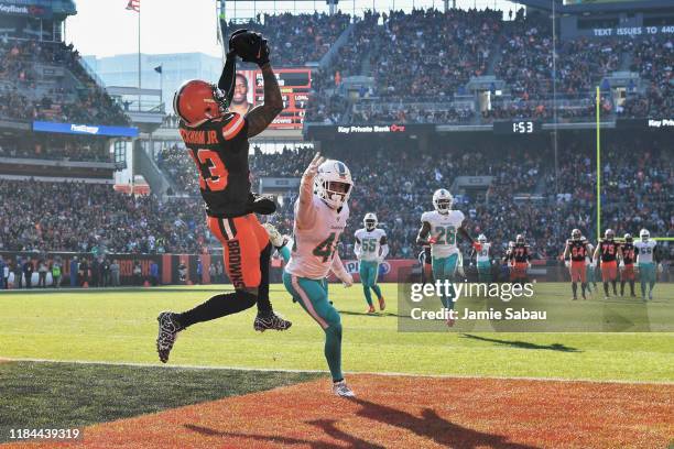 Odell Beckham Jr. #13 of the Cleveland Browns pulls in a 35-yard touchdown catch in the first quarter as Nik Needham of the Miami Dolphins defends at...