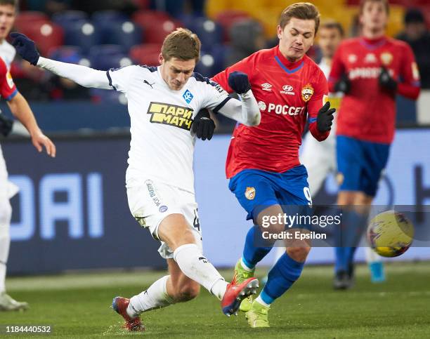 Ivan Oblyakov of PFC CSKA Moscow and Artyom Timofeyev of FC Krylia Sovetov Samara vie for the ball during the Russian Football League match between...