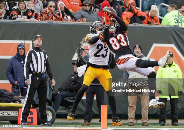 Tyler Boyd of the Cincinnati Bengals goes up for a touchdown catch as Joe Haden of the Pittsburgh Steelers defends during the first half at Paul...