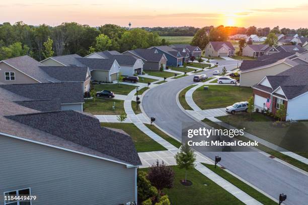 aerial view of suburban neighborhood - nachbarschaft stock-fotos und bilder