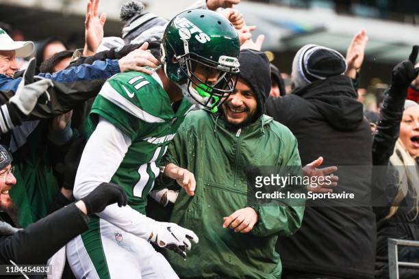 New York Jets Wide Receiver Robby Anderson jumps into the stands after scoring a touchdown during the third quarter of the National Football League...