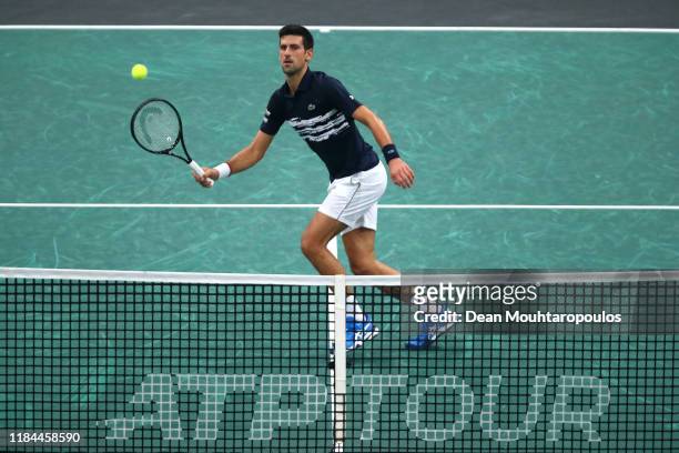 Novak Djokovic of Serbia returns a forehand in his match against Corentin Moutet of France on day 3 of the Rolex Paris Masters, part of the ATP World...