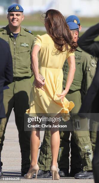 Catherine, Duchess of Cambridge speaks to soldiers as she arrives at Calgary Airport on July 7, 2011 in Calgary, Canada. The newly married Royal...