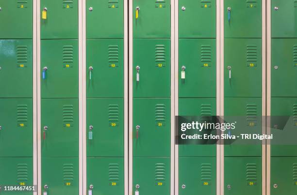 wall of lockers in a dressing room of the gym - taquilla lugar de comercio fotografías e imágenes de stock