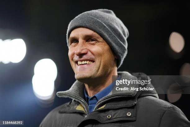 Former Borussia Moenchengladbach player Heiko Herrlich looks on prior to the DFB Cup second round match between Borussia Dortmund and Borussia...