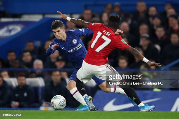 Christian Pulisic of Chelsea is challenged by Fred of Manchester United during the Carabao Cup Round of 16 match between Chelsea and Manchester...