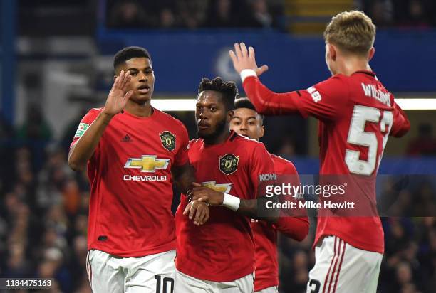 Marcus Rashford of Manchester United celebrates after scoring his team's first goal with Brandon Williams and Fred of Manchester United during the...
