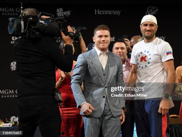 Boxer Canelo Alvarez and WBO light heavyweight champion Sergey Kovalev pose during a news conference at the KA Theatre at MGM Grand Hotel & Casino on...
