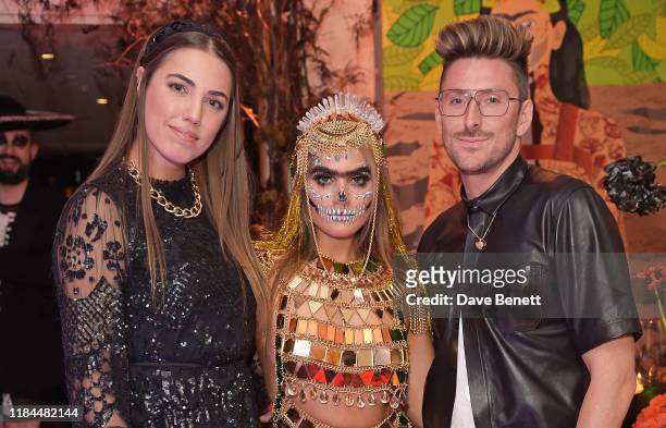 Amber Le Bon, Sophia Hadjipanteli and Henry Holland attends Ella Canta's Day of the Dead celebration on October 30, 2019 in London, England.