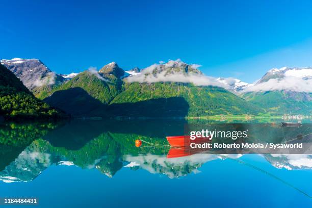 boats in oppstrynsvatn lake, hjelle, norway - olden foto e immagini stock