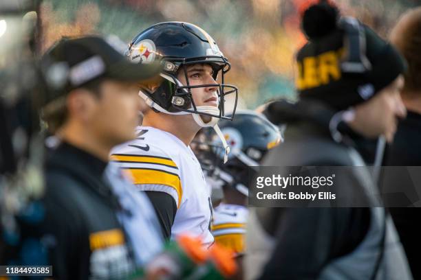 Mason Rudolph of the Pittsburgh Steelers watches from the sidelines after being benched in the third quarter of the game against the Cincinnati...