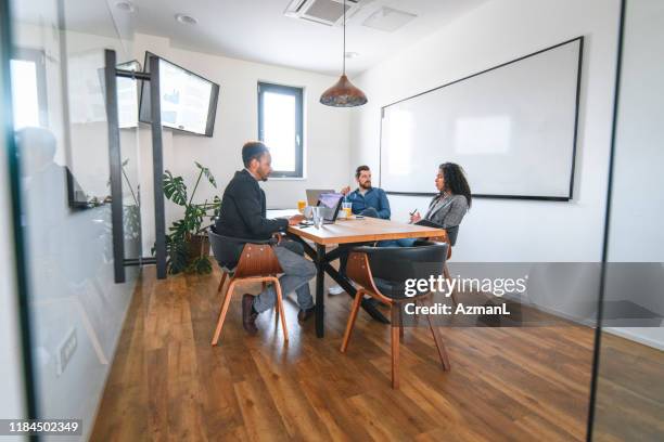 business colleagues discussing ideas in conference room - general view stock pictures, royalty-free photos & images